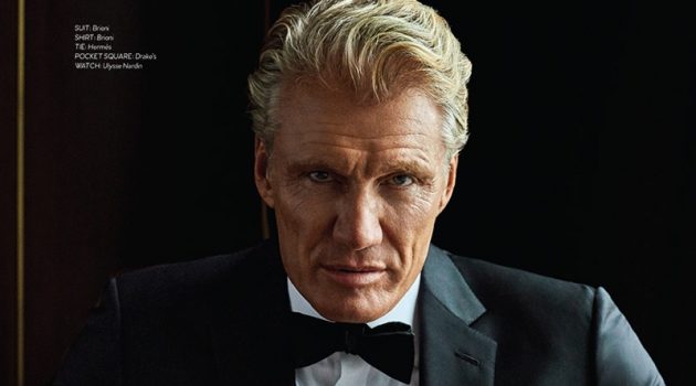 Donning a Brioni tuxedo and shirt, Dolph Lundgren also wears a Hermès bow-tie, Drake's pocket square, Bruno Magli boots, and an Ulysse Nardin watch.