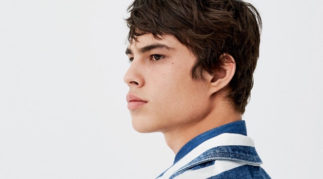 Louis Baines sports a striped denim jacket by Pull & Bear.