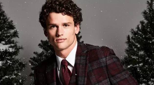 Christmas Dinner: Embracing checks, Simon Nessman sports a Lauren by Ralph Lauren classic-fit tartan plaid wool sport coat and vest. He also dons a clean white dress shirt.