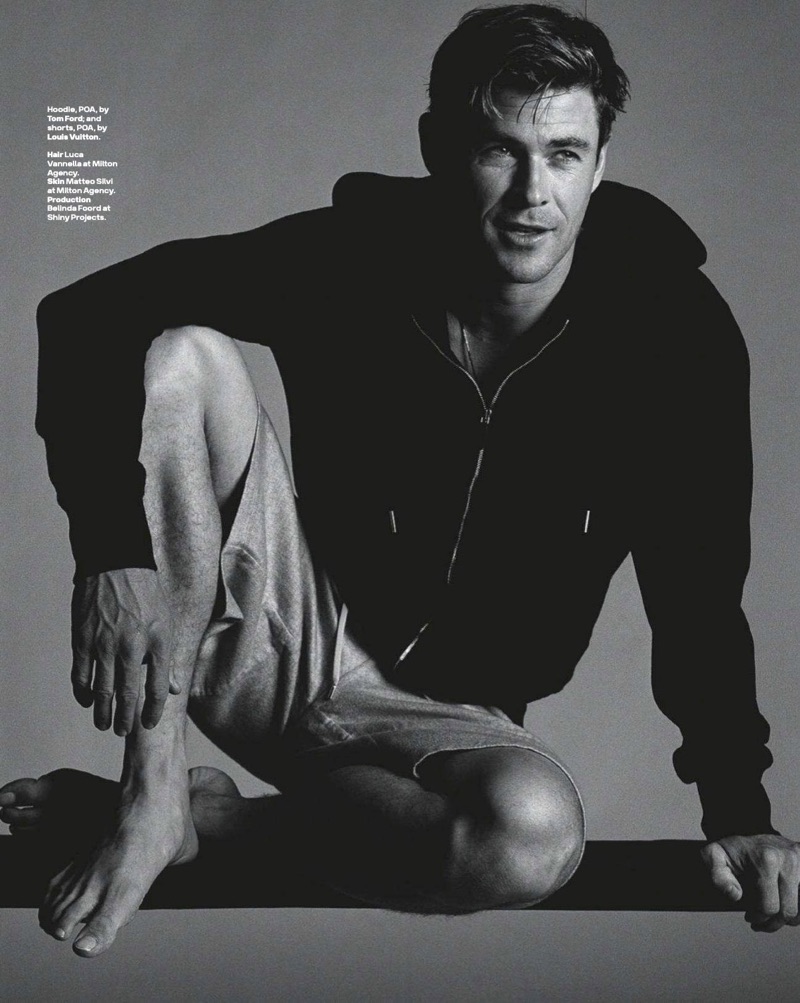 Appearing in a GQ Australia photo shoot, Chris Hemsworth wears a Tom Ford hoodie and Louis Vuitton shorts.