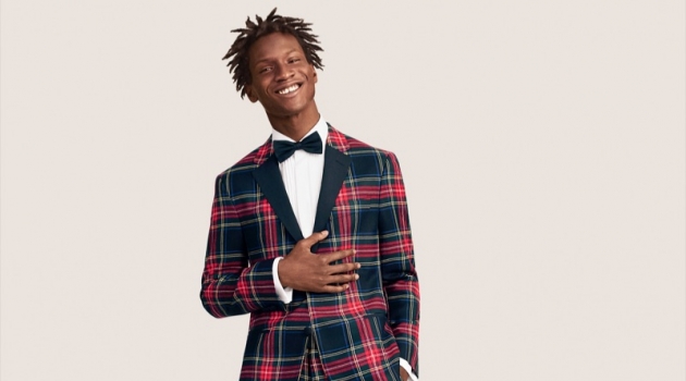 Adonis Bosso dons a wool tartan suit from Tommy Hilfiger.