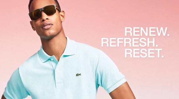 Conrad Bromfield embraces pastel spring style in a Lacoste polo shirt.