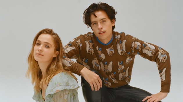 Sporting a Coach Dumbo sweater, Cole Sprouse appears in a photo shoot with Haley Lu Richardson.