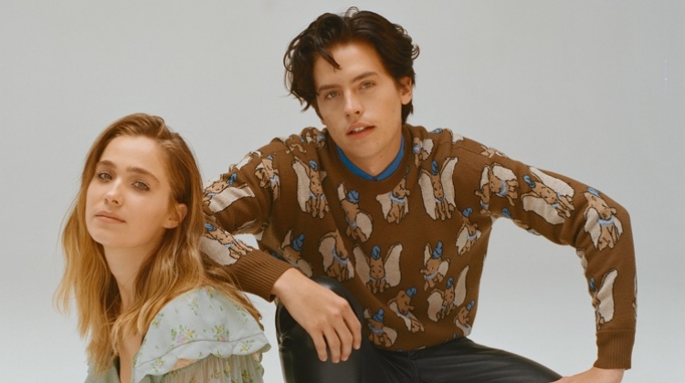 Sporting a Coach Dumbo sweater, Cole Sprouse appears in a photo shoot with Haley Lu Richardson.