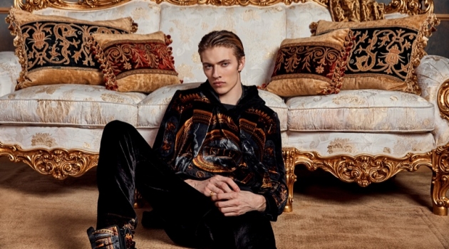 Relaxing, Lucky Blue Smith wears Kith x Versace.