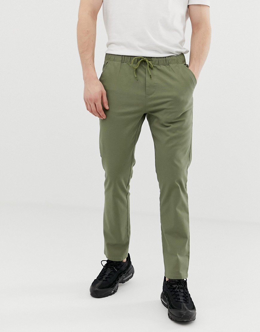 ASOS DESIGN slim chinos with elastic waist in light khaki – Green | The ...