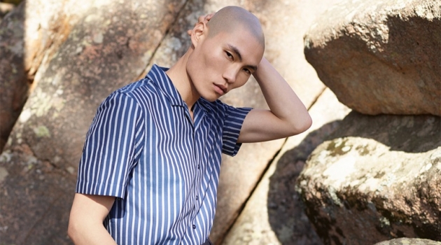 Ready for summer, Jean Chang sports a striped short-sleeve shirt with oversized tailored shorts from Reserved's Re.Design collection.