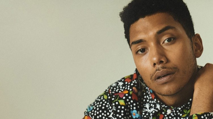 Embracing an all-over print, Chance Perdomo dons an outfit by Versace.