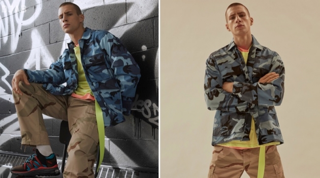 Mixing camouflage prints, Augusta Alexander sports a ROTHCO blue tactical camo shirt and camouflage cargo pants with a neon DJAB t-shirt. He completes his look with a yellow Outcome belt.