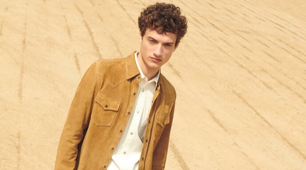 Serge Rigvava embraces western style in a suede overshirt with a Calvin Klein shirt, Gucci jeans, and suede ankle boots.