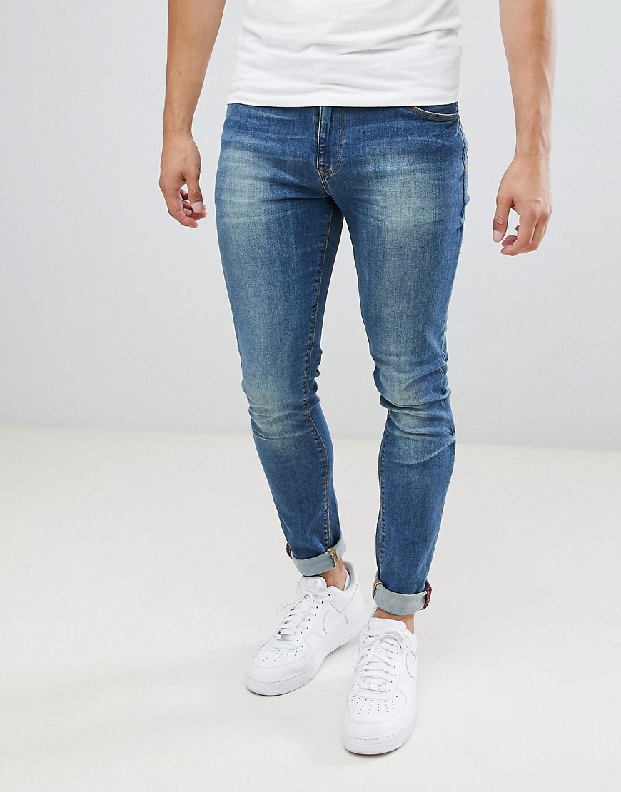 ASOS DESIGN skinny jeans in mid blue wash – Blue | The Fashionisto