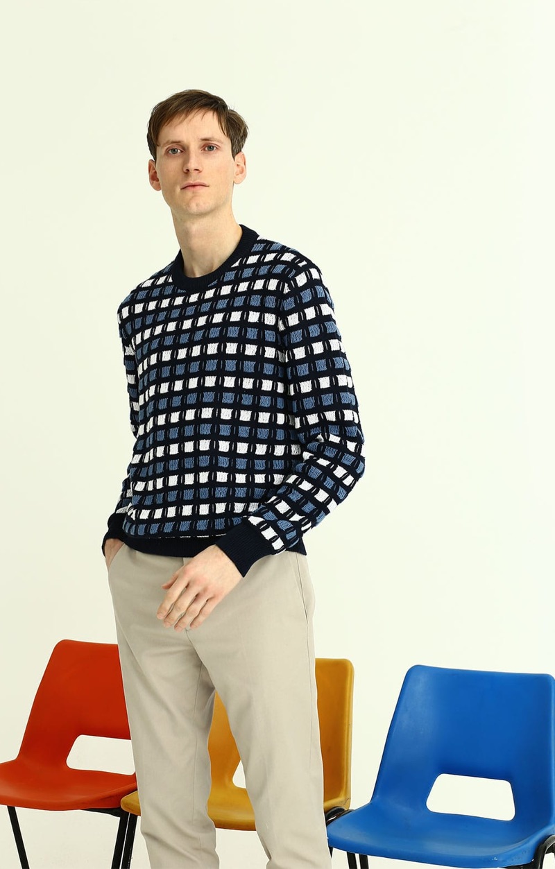 Model Bastiaan Ninaber sports a Marni textured knit sweater with Paul Smith chinos.