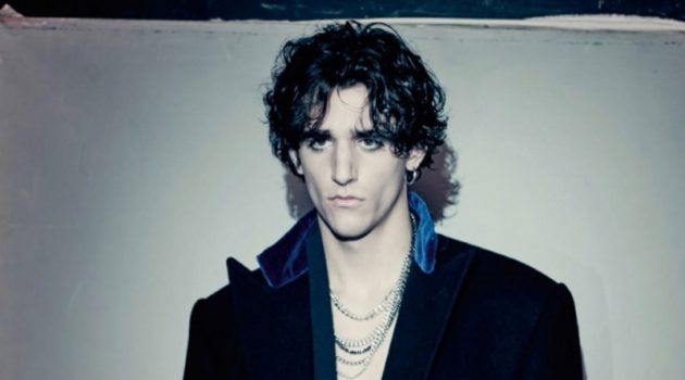 Tamino sports a wool coat by Ralph Lauren Purple Label with a velvet robe from Triple RRR.