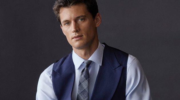 Front and center, Garrett Neff models a shirt, waistcoat, and tie by Massimo Dutti.