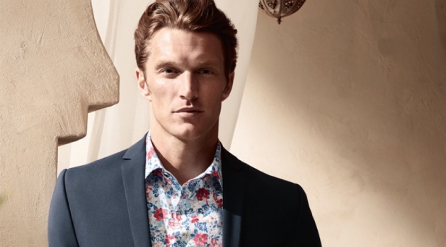 Shaun Dewet wears a floral print shirt with a smart blazer from OLYMP.