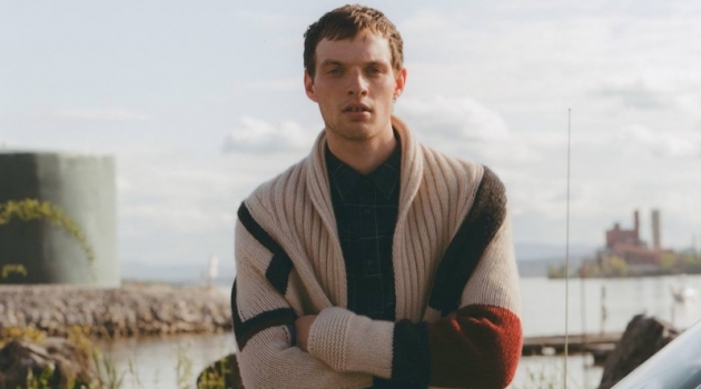 Ready for the new season, Rocky Harwood models a Connolly cardigan, A.P.C. shirt, and Helmut Lang shorts.