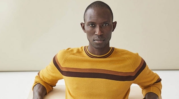 Armando Cabral sports a mustard yellow fine Italian merino wool stripe sweater $198 from Todd Snyder.