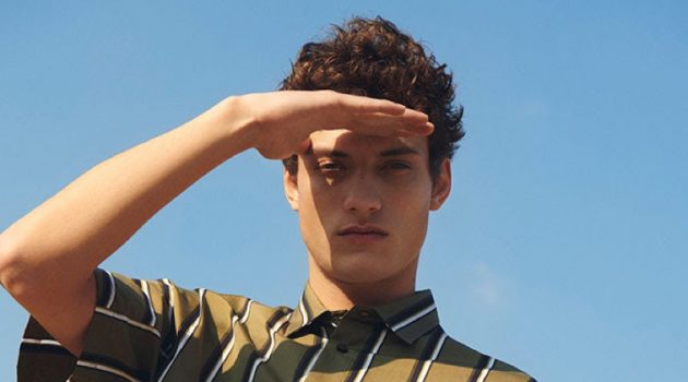 Serge Rigvava sports a striped short-sleeve shirt by OAMC.