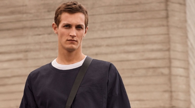 Committing to a black and white look, Rutger Schoone rocks an oversized tee from COS.