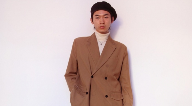 Hidetatsu wears beret SCHA, suit jacket Gentle x Cover, turtleneck Calvin Klein, necklace XU Harajuku, jeans MISBHV, and boots Dries Van Noten.