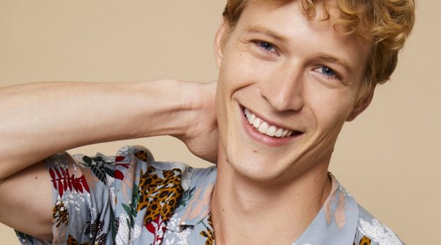 All smiles, Sven de Vries models a printed shirt from Basement.