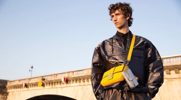 Etienne de Testa sports Fendi's leather Baguette bag in yellow.