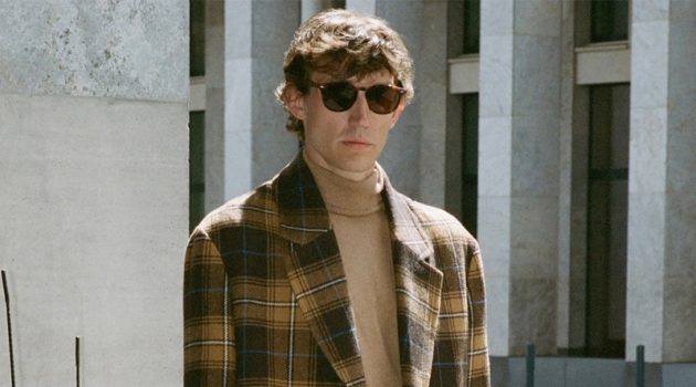 Thilo Muller dons a plaid coat and turtleneck sweater by Reserved.