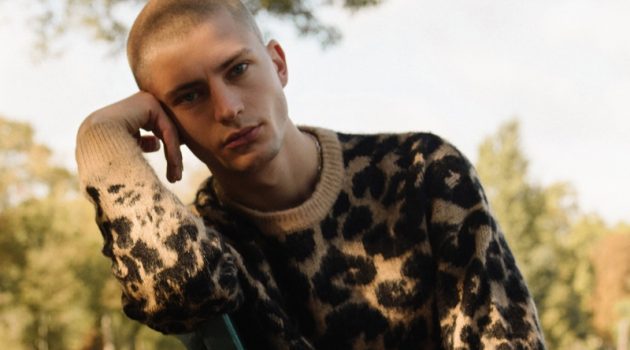 Lucas Berny sports a leopard print sweater from Reserved.