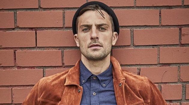 Standing out in a beautiful rust color, Rafael Lazzini dons a Todd Snyder Italian suede jacket $998 with a brushed cotton cashmere shirt $178 in navy and distressed denim jeans.