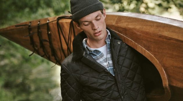 Model Rocky Harwood dons a Barbour plaid shirt and quilted jacket with a POLO Ralph Lauren pocket tee.