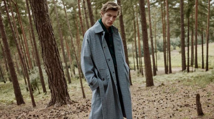 Finnlay Davis dons an oversized belted gingham wool-blend coat by Acne Studios.