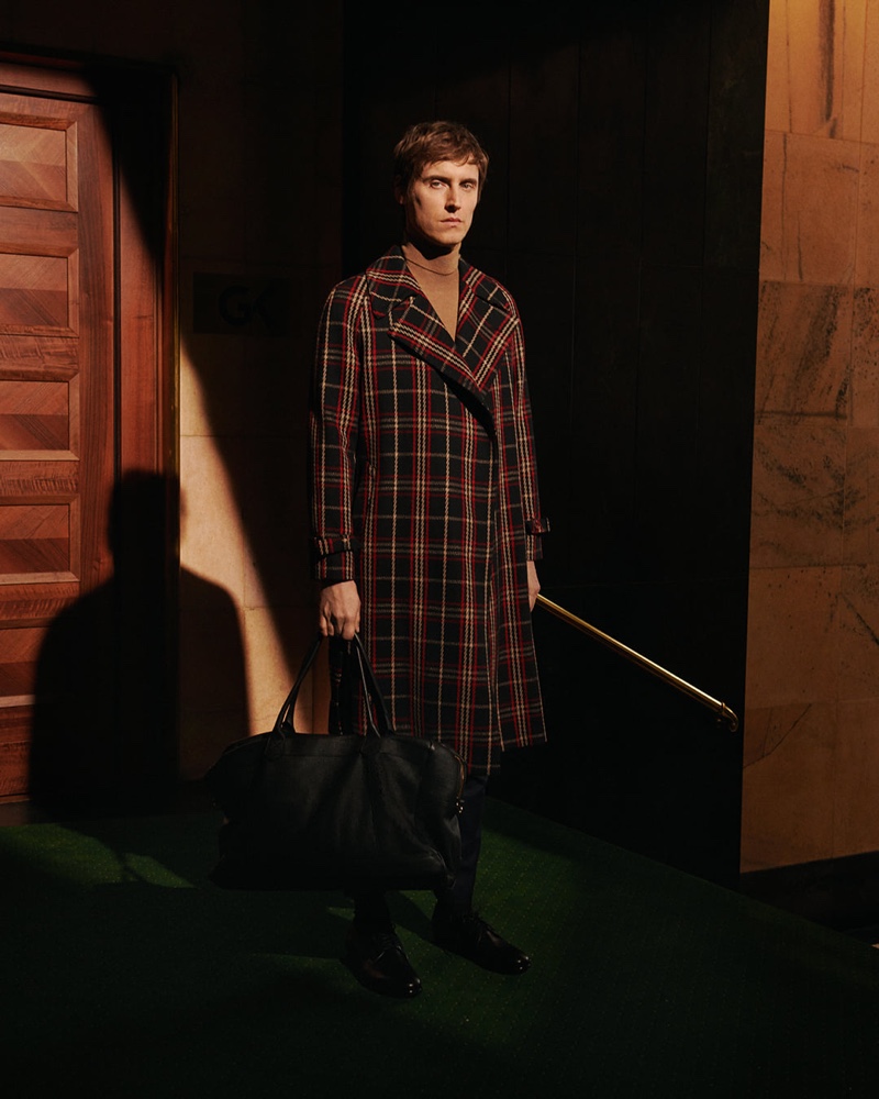 Making a case for the tartan coat, Sébastien Andrieu appears in Tagliatore's fall-winter 2019 campaign.
