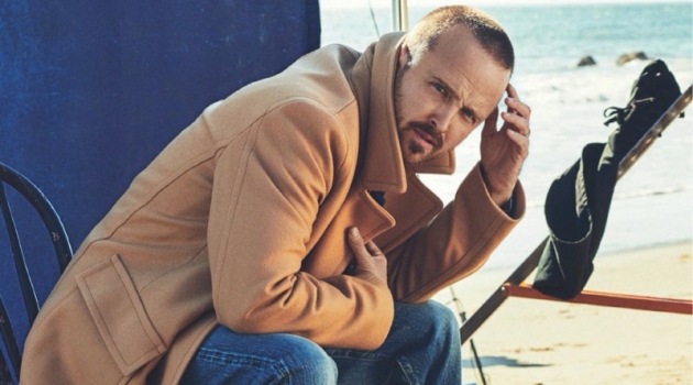 Starring in a photo shoot for Men's Journal, Aaron Paul sports a Mr P. coat, The Workers Club Denim Jeans, and Kenneth Cole boots.