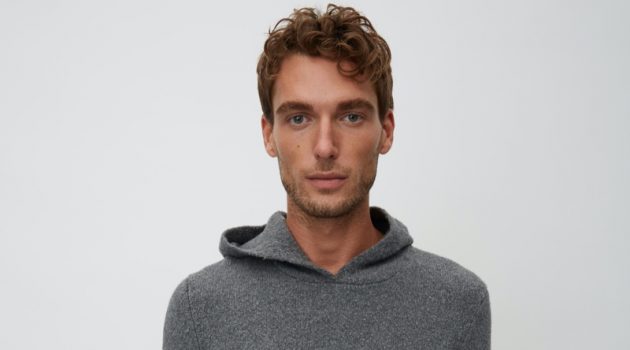 Nikola Jovanovic wears a grey hooded knit from Marc O'Polo's Christmas collection.