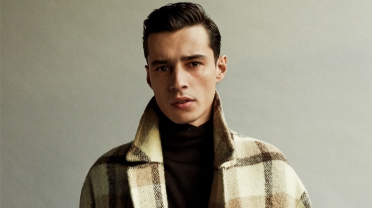 Front and center, Adrien Sahores dons a checked coat from Zara.