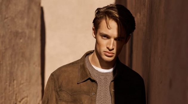 Embracing shades of brown, Morton Nielsen wears a suede shirt jacket with a cable-knit sweater.