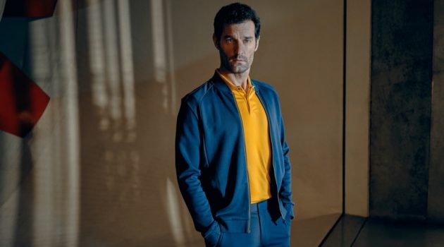 Embracing blue and yellow, Mark Webber fronts the Porsche x BOSS spring-summer 2020 campaign.