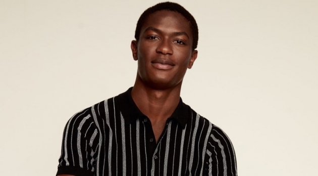 Reuniting with Mango, Hamid Onifade models a striped knit polo.