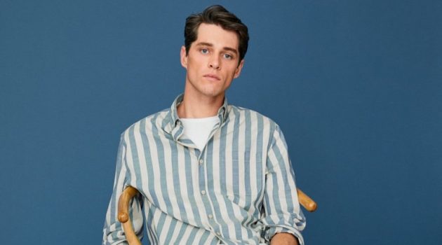 Luke Powell models a striped cotton shirt with regular fit jeans from Mango.