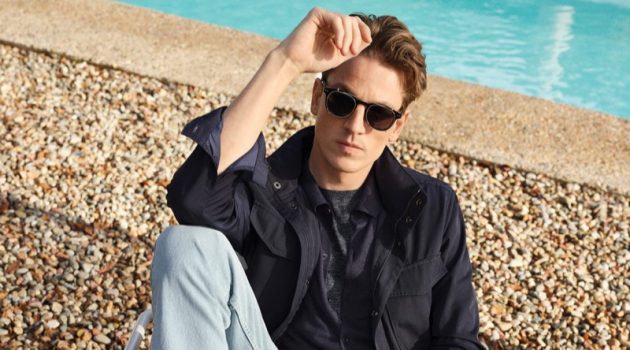 Relaxing poolside, Hugo Sauzay wears Mango's regular fit Bob jeans with a field jacket.