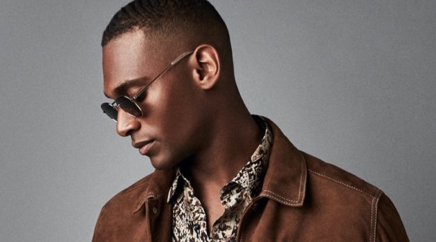 Embracing western style, Patrick Nodanche models a brown suede Hurst jacket from Reiss. He also rocks the brand's Adder snake print shirt with its Etna jeans and Rio sunglasses.