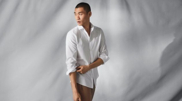 Kamui Tanaka dons a crisp white shirt that uses H&M's Coolmax fabric technology.