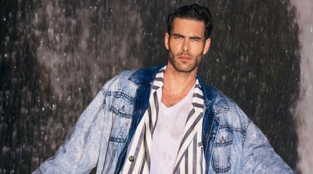 Miami Vice meets the Fresh Prince of Bel-Air as Jon Kortajarena dons a striped suit with a denim jacket for Balmain's resort 2021 campaign.