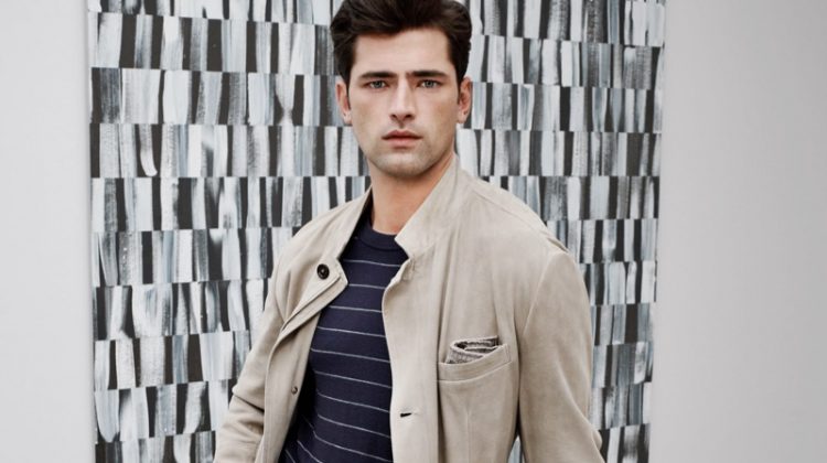 Sean O'Pry sports a striped wool sweater, stretch wool cargo pants, and sneakers from Eleventy.