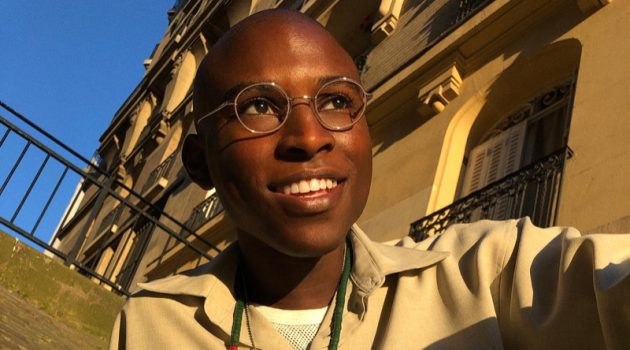 All smiles, Jibril Durimel wears Warby Parker's Simon glasses in brushed ink.