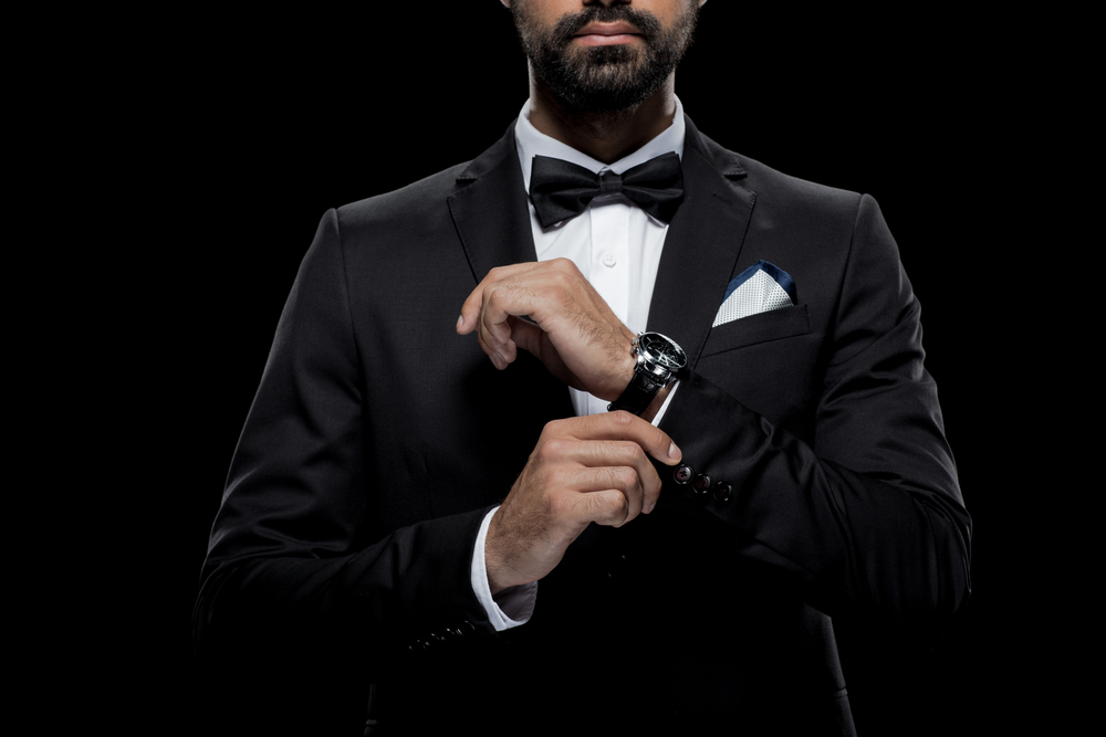 Premium Photo  Stylish bearded man in suit and scarf playing in dark casino