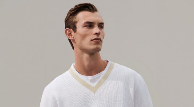 A smart vision in white, Kit Butler models a chic look from COS' 'To the Sea' collection.