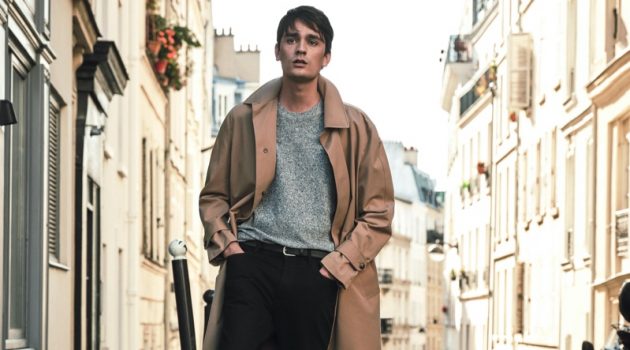 Stepping outside into the Parisian streets, Alain-Fabien Delon sports a trench coat and more essentials from Mango Man.