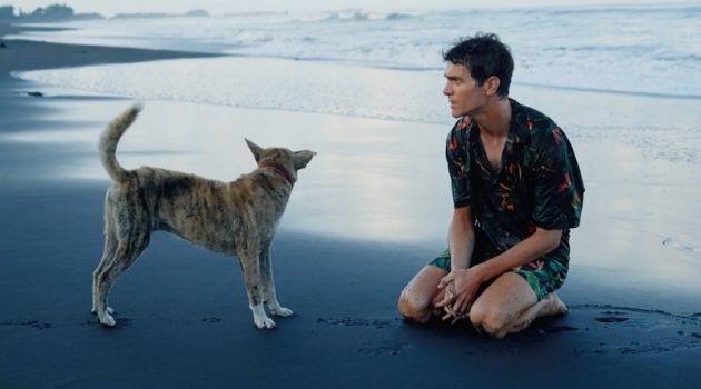 French model Vincent Lacrocq takes to the beach in a matching leaf print shirt and swim shorts by Zara.