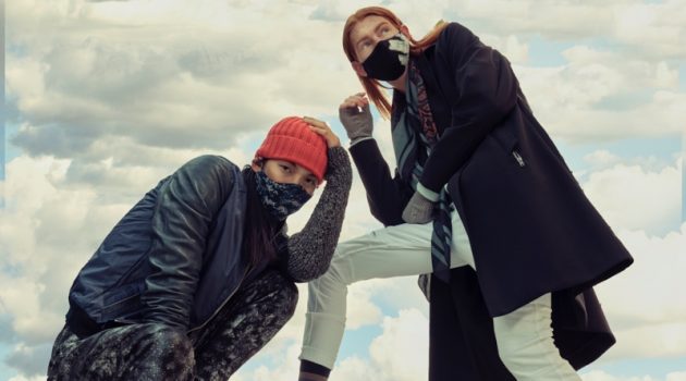 Left: Sooleen wears bomber Hip and Bone, beanie Leone Napoli, sneakers Puma, printed mask Mayer Man Custom, tank and pants House of Dwir. Right: Jayden wears hand warmers Aldo, socks Hudson's Bay, sneakers Hip and Bone, mask, Mayer Man Custom, pants and scarf H&M, sweater and trench Christopher Bates.